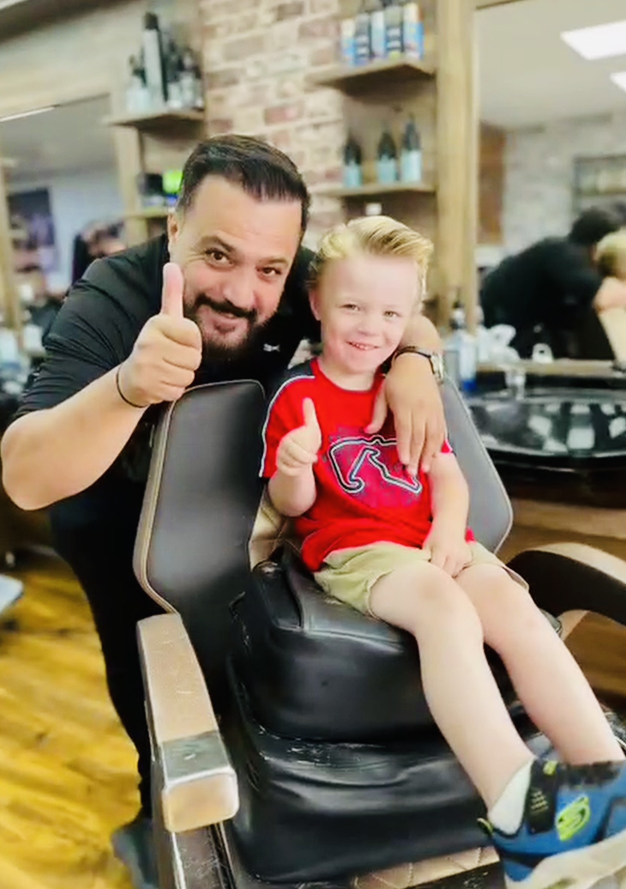 Barber Nail Yildirim with a happy young customer